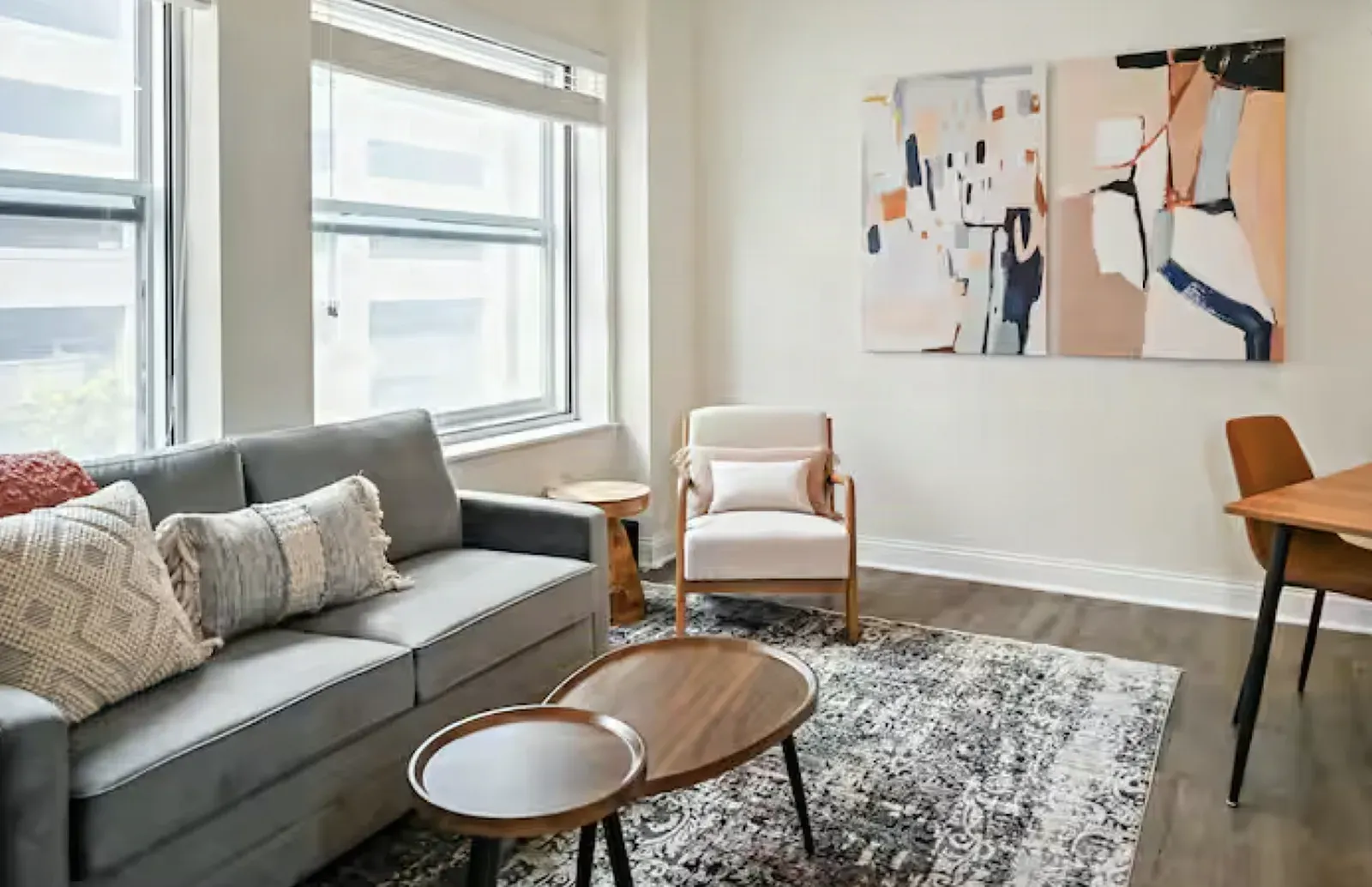 Converted apartment living room with finished painted drywall walls, a picture window, and recessed ceiling lights